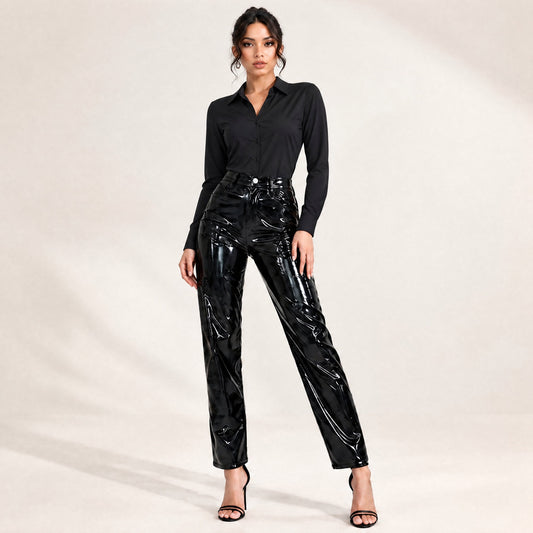 Model wearing black shiny faux leather high-waisted straight-leg ankle pants