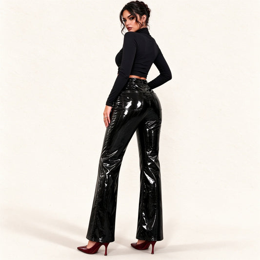 Model wearing black patent faux leather high-waisted flare pants with exposed front zip