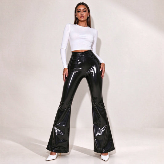 Model wearing black patent faux leather high-waisted wide-leg flare pants